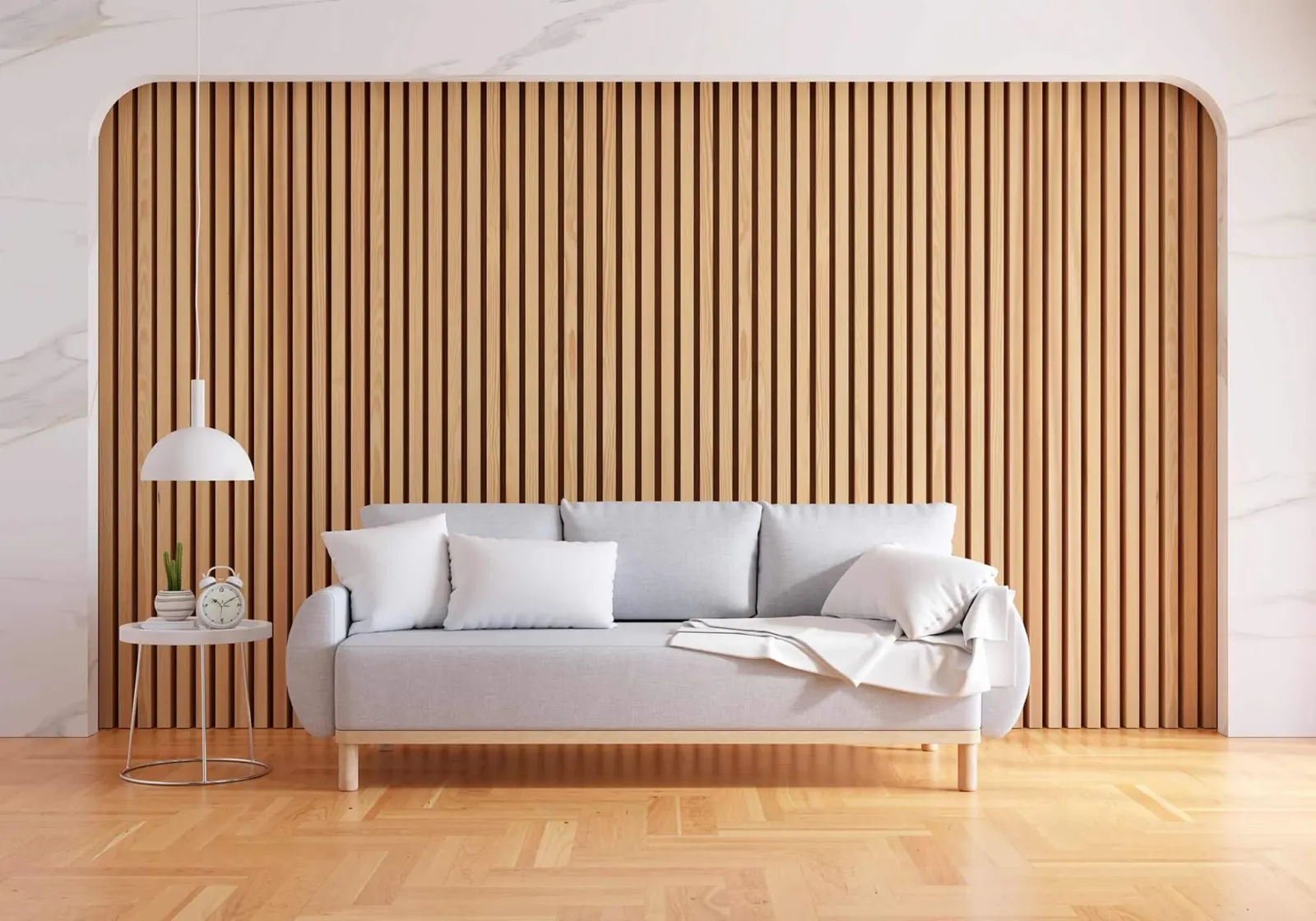 Slatted oak wall cladding behind a white sofa